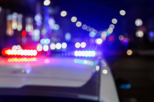 How to Sue a Police Department in California 2 Police patrol lights at night, indicating an active law enforcement scene.