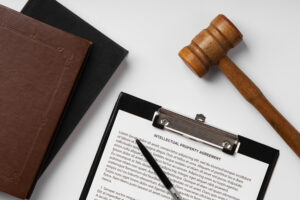Reasonable Cause Definition: What It Means in Arrest and Search Cases 2 Signed legal contract placed next to a Supreme Court gavel.