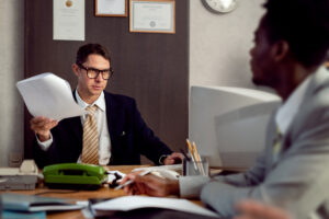 What It Means and Your Rights in California 2 Civil rights attorney reviewing police reports with a client.