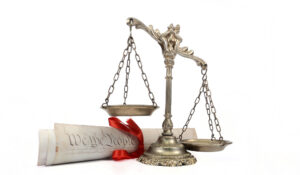 What Is the Difference Between Civil Liberties and Civil Rights? 1 Scales of justice and a legal document.