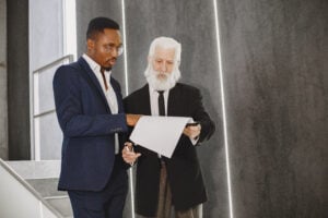 How Long Does It Take to Settle Wrongful Death Claims and How Do You File a Lawsuit? 1 Lawyers reviewing legal documents during office meeting