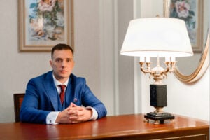 Compensation for False Arrest: What Victims May Be Entitled To 2 Attorney seated at desk during legal consultation