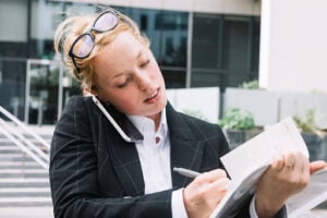 How Long After an Incident Can You Sue? Understanding California Deadlines 2 Person reviewing documents and managing legal filing deadlines
