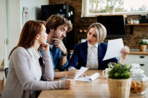 How Much Can You Sue for Verbal Abuse? Understanding Your Legal Options 2 Lawyer meeting with clients to review legal options