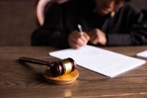 Criminal Case Meaning: What Is the Difference Between a Civil and Criminal Case? 1 A courtroom gavel resting on a desk beside legal documents