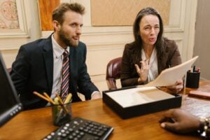 How to Counter Sue in Small Claims and What Police Excessive Force Cases Can Teach About Legal Claims 1 Two people reviewing paperwork before a small claims court hearing in California
