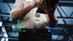 When Police Ignore the Evidence That Clears You: Dispelled Suspicion and Exculpatory Facts 1 IT specialist using a tablet while managing data center systems.
