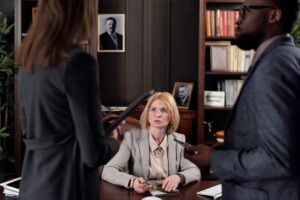 "Am I Free to Go?" Consensual Encounters and When Police Can Actually Seize You 2 Lawyers discussing a legal case during a meeting in a professional law office.