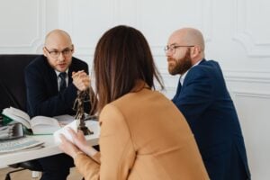 "Am I Free to Go?" Consensual Encounters and When Police Can Actually Seize You 1 Lawyers meeting with a client to discuss a legal case and review documents.
